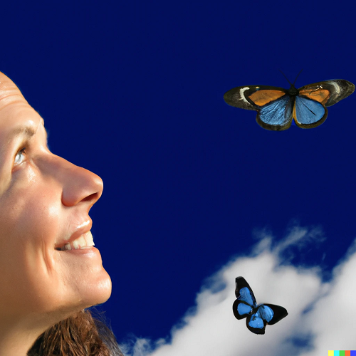 woman looking up to blue sky with butterflies